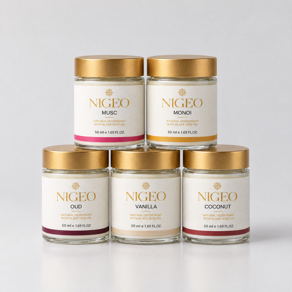 Five NIGEO cream deodorant jars in a pyramid, the complete range
