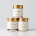 Three NIGEO cream deodorant jars in a pyramid, Oud, Musc and Vanilla